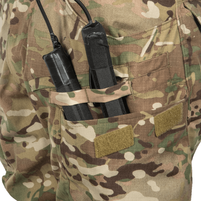 Cargo pocket pass-throughs for door charges