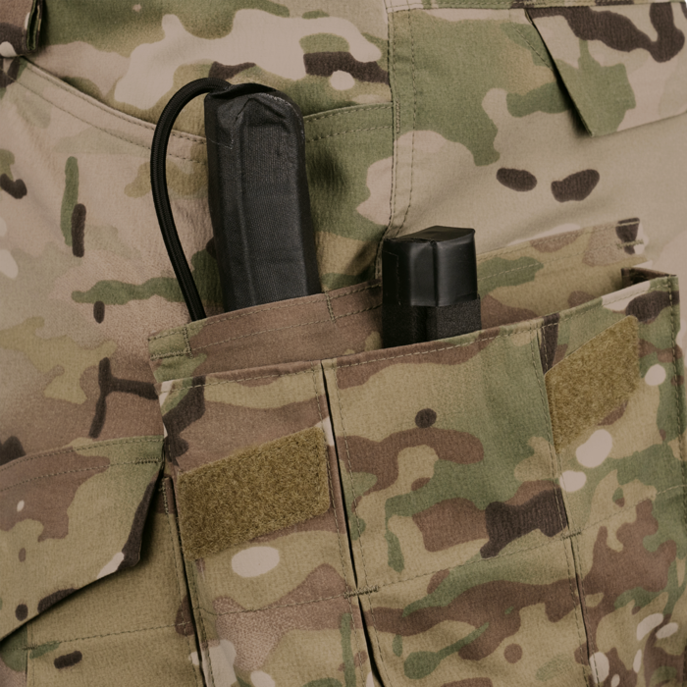 Elastic loops in cargo pockets for securing items Elastic loops in cargo pockets for securing items
